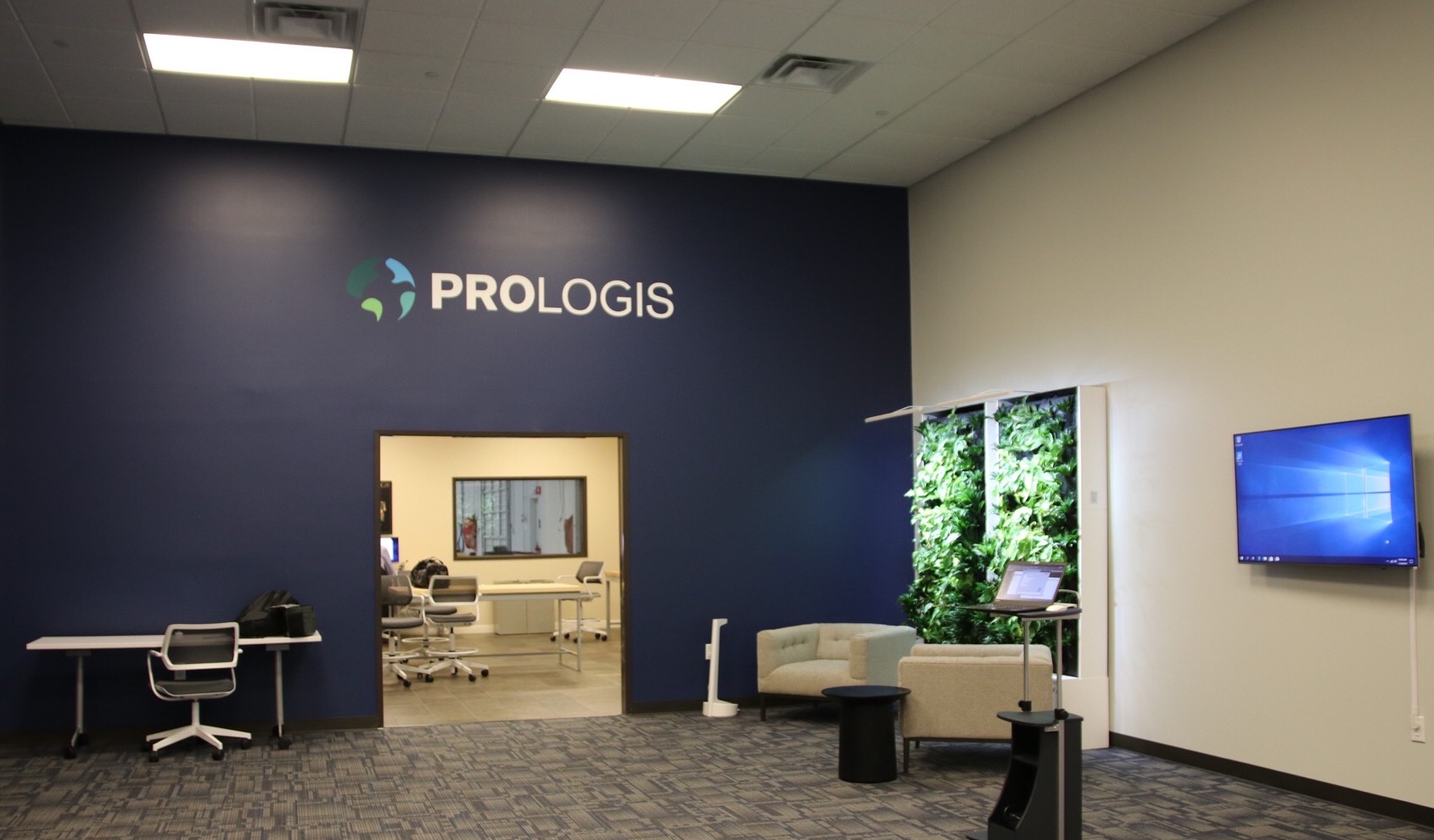 An image shows the interior of the Prologis Labs facility with a reception area and work space.