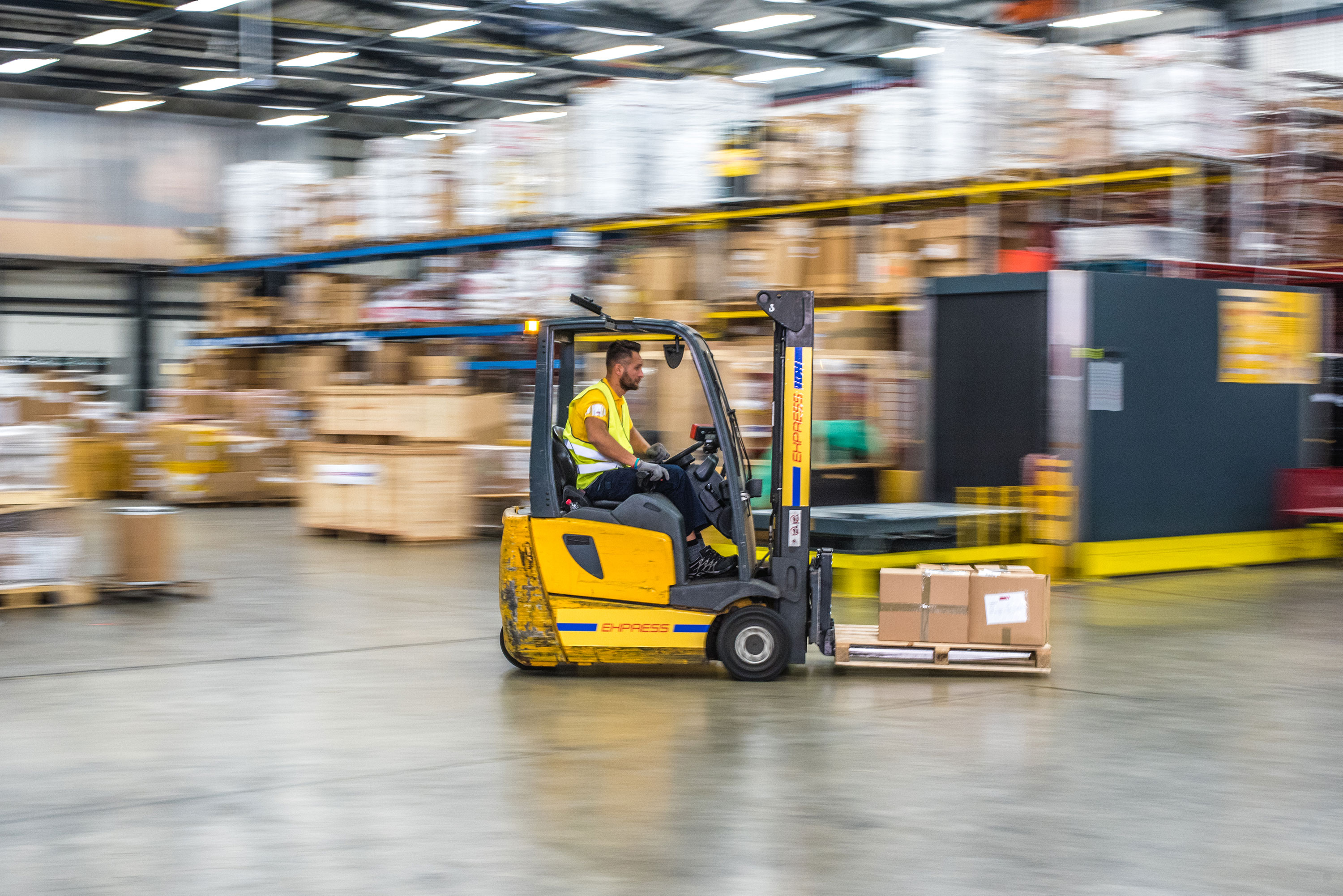 Warehouse employee on a forklift