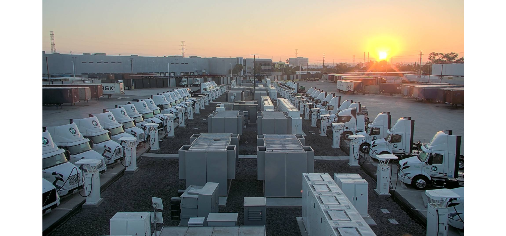 Trucks in a lot being charged