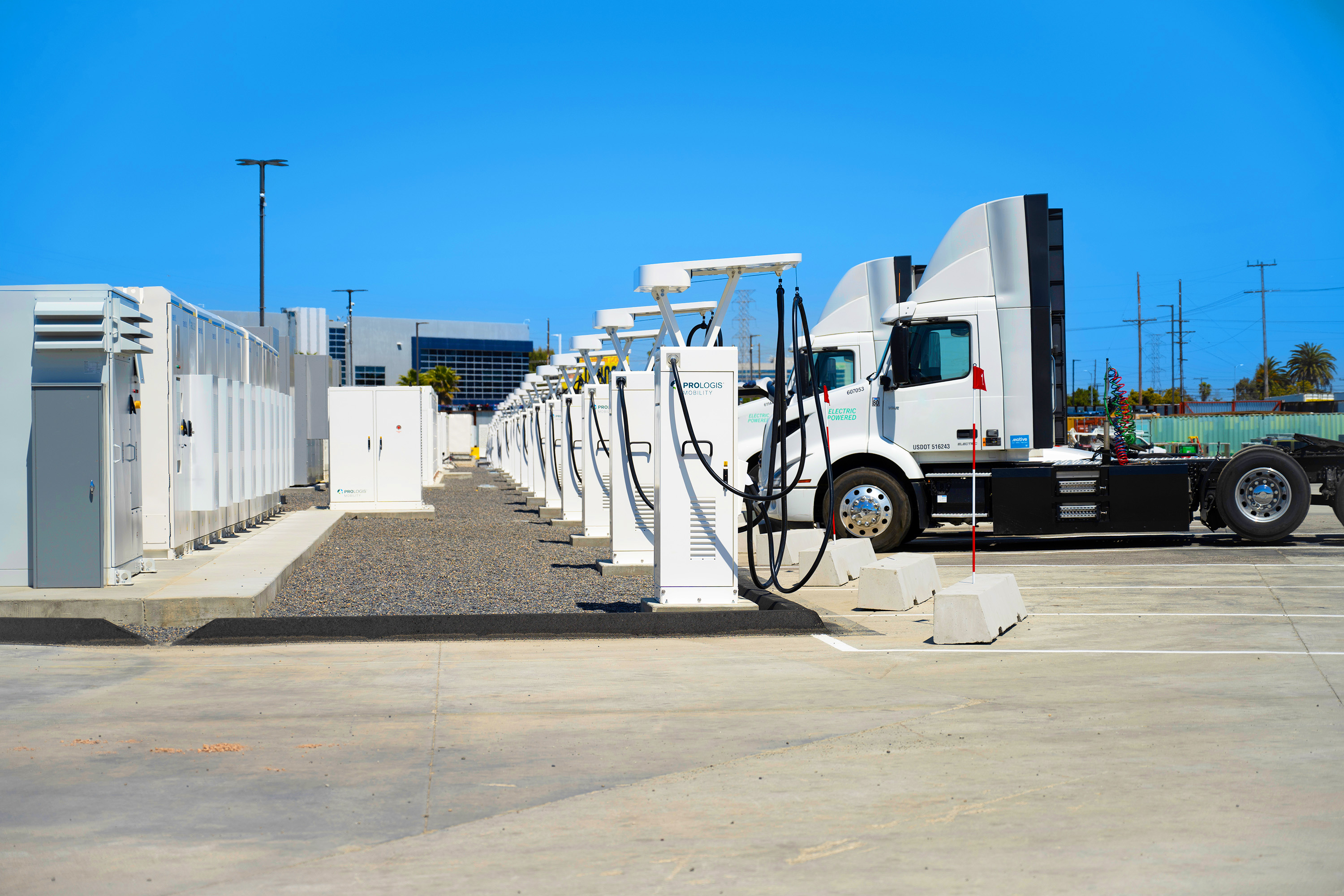 Trucks charging at a charging station
