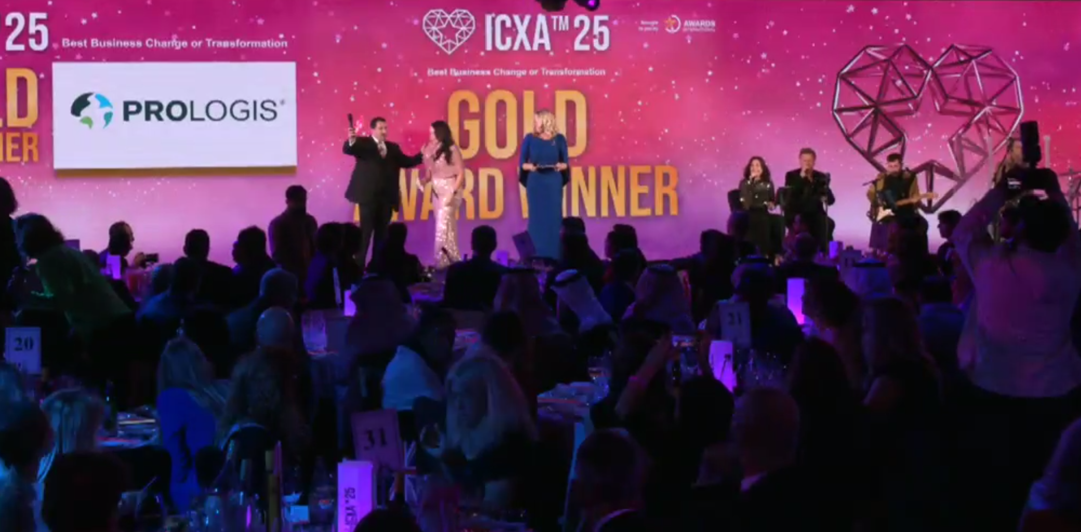 Image of a person accepting an award onstage