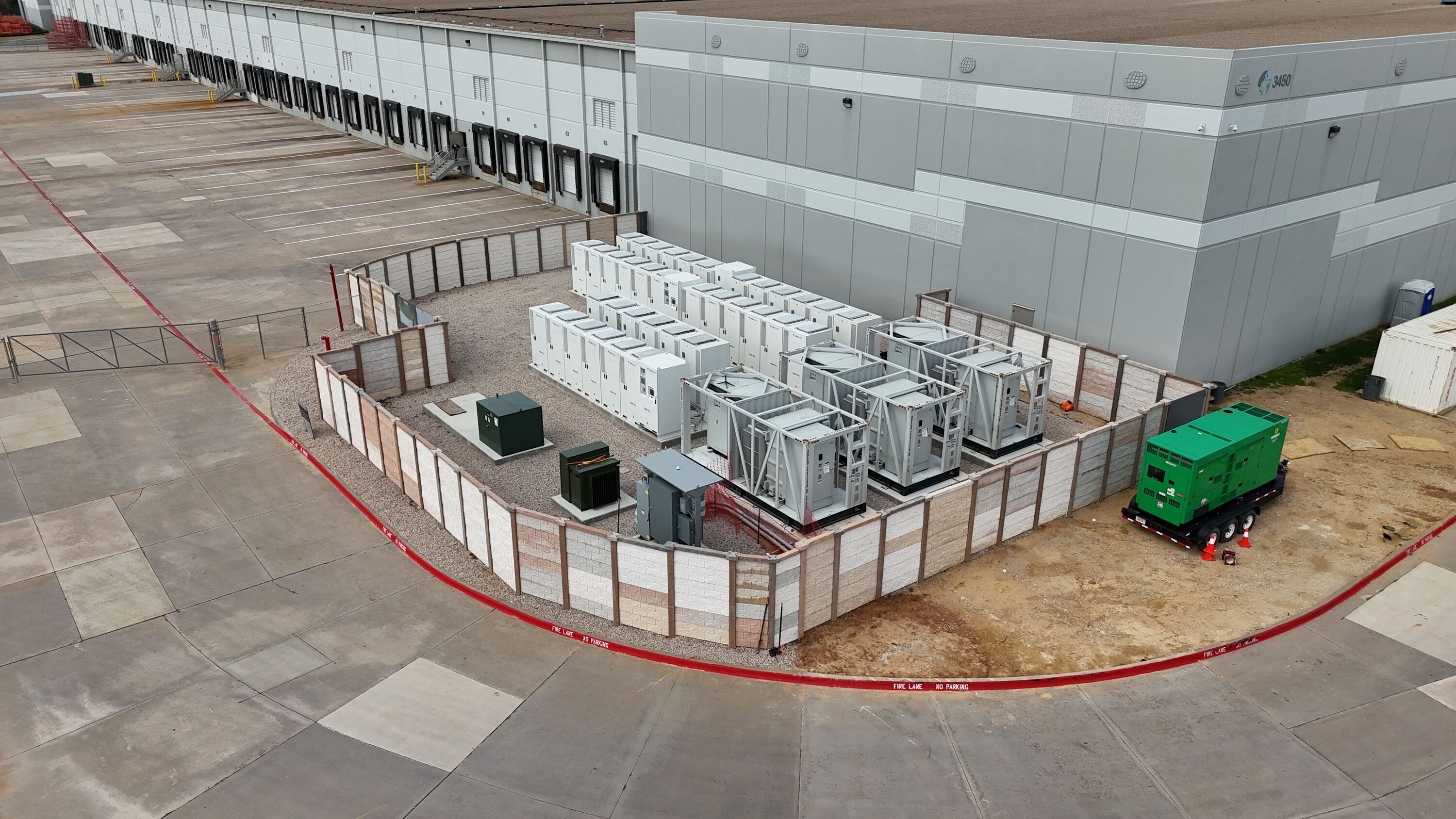 Exterior view of a warehouse showing battery storage
