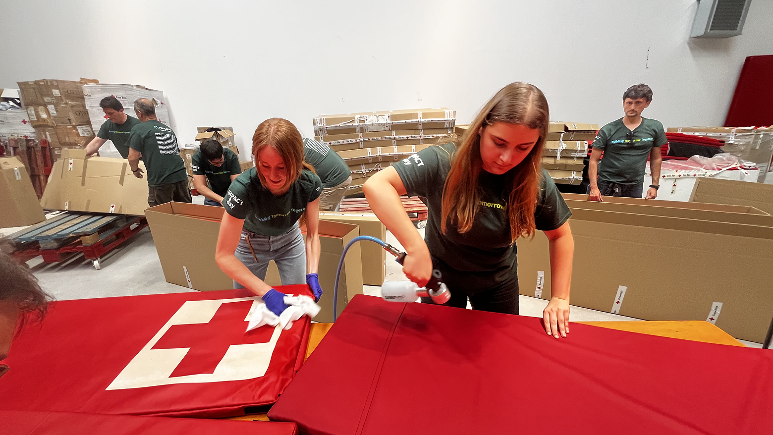 Two people working on a painting project