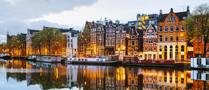 Night view along the Amstel River in Amsterdam, the Netherlands