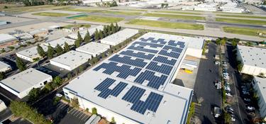 Solar panels on the roof of Prologis Van Nuys Distribution Center 3 in Van Nuys California. Surrounding mountains in the distance