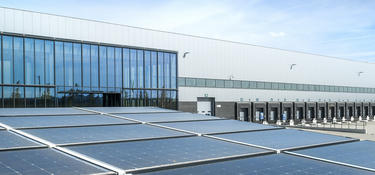 Exterior view showing solar panels on the roof of Venlo distribution center