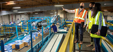 Prologis team members tour a sorting facility in Fremont, California.