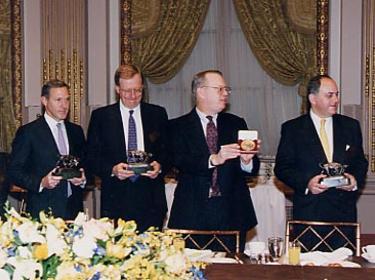 Prologis Timeline - 1997 4 members of AMB Management in 1997 behind a dinner table holding awards