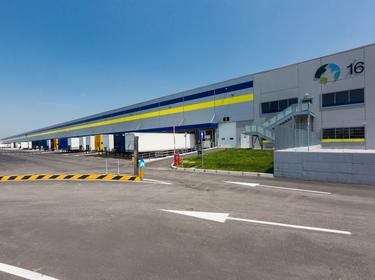 An exterior shot of Prologis Bologna Interporto DC16 with trucks parked in the truck court