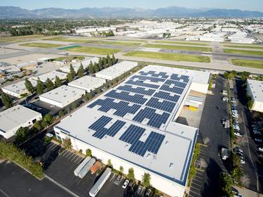 Solar panels on the roof of Prologis Van Nuys Distribution Center 3 in Van Nuys California. Surrounding mountains in the distance