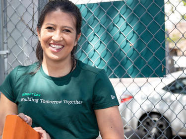 A Prologis email employee wears a green Prologis t-shirt for IMPACT Day 2019