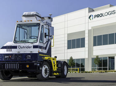 Outrider Truck in front of a Prologis Warehouse
