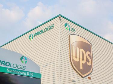 Up close shot of Prologis building signage with old Prologis logo and UPS logo on corner of Prologis Venlo Distribution Center 2 in Venlo, Nethelands