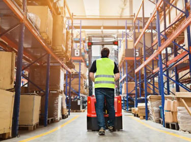 Warehouse worker with a pallet jack