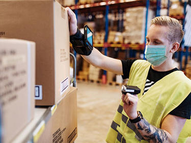 Person using a package scanner