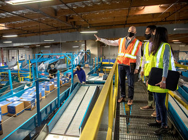 Prologis team members tour a sorting facility in Fremont, California
