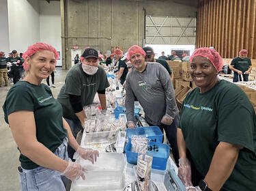 A group of people volunteering for IMPACT day