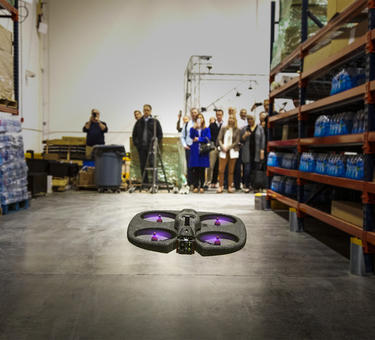 A tour group witnesses a drone in action at a Prologis Labs test environment