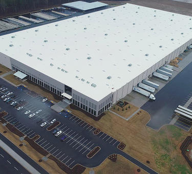Aerial photo of a warehouse and surrounding parkinglot and truck courts