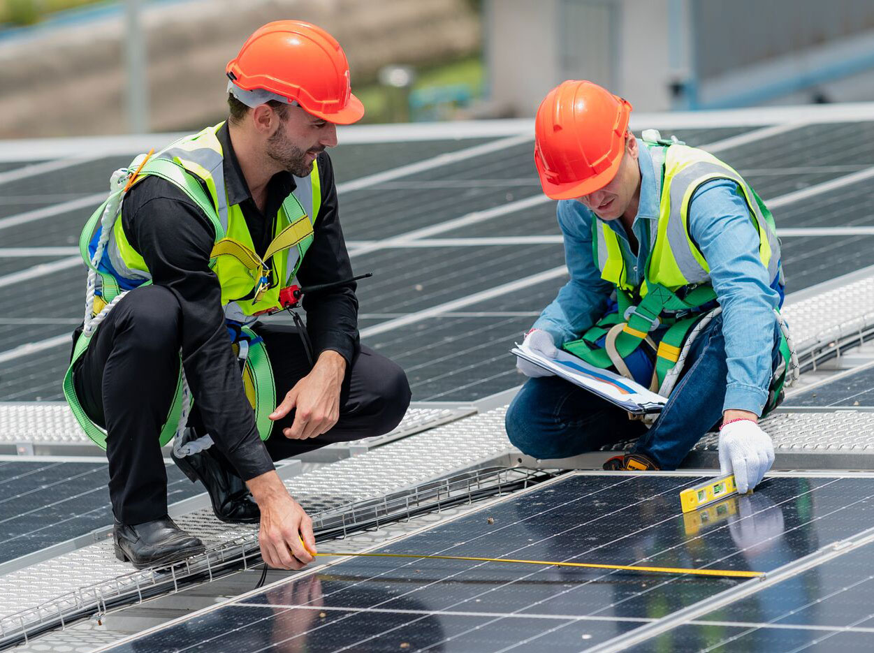 dpm-examing-solar-panels.jpg DPM workers Examining Solar Panels