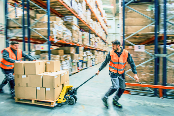 workers moving boxes in warehouse workers moving boxes in warehouse