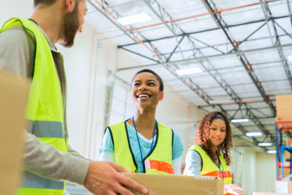 workers socializing and working in warehouse workers socializing and working in warehouse